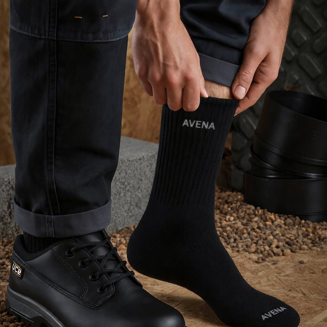 Avena alpaca compression sock being pulled on beside a work shoe